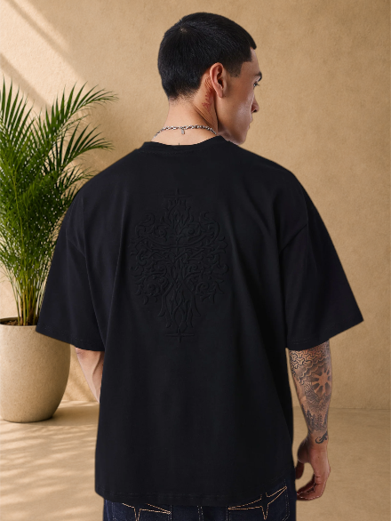 Stayin black boxy fit cotton t-shirt with large tonal embossed motif on the back, worn by a man
