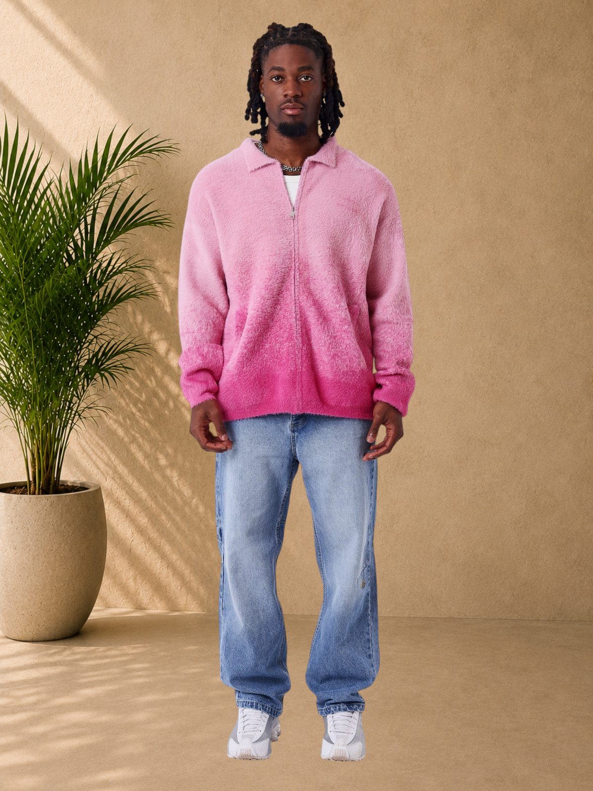 Stayin PXP pink fluffy zip-up vest with a shirt collar and oversized fit worn by a model with blue jeans