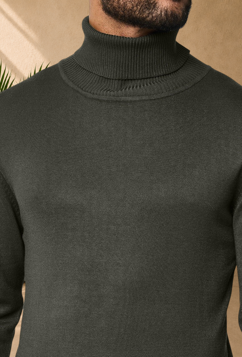 Stayin men's slim-fit khaki turtleneck sweater with ribbed collar worn by a model