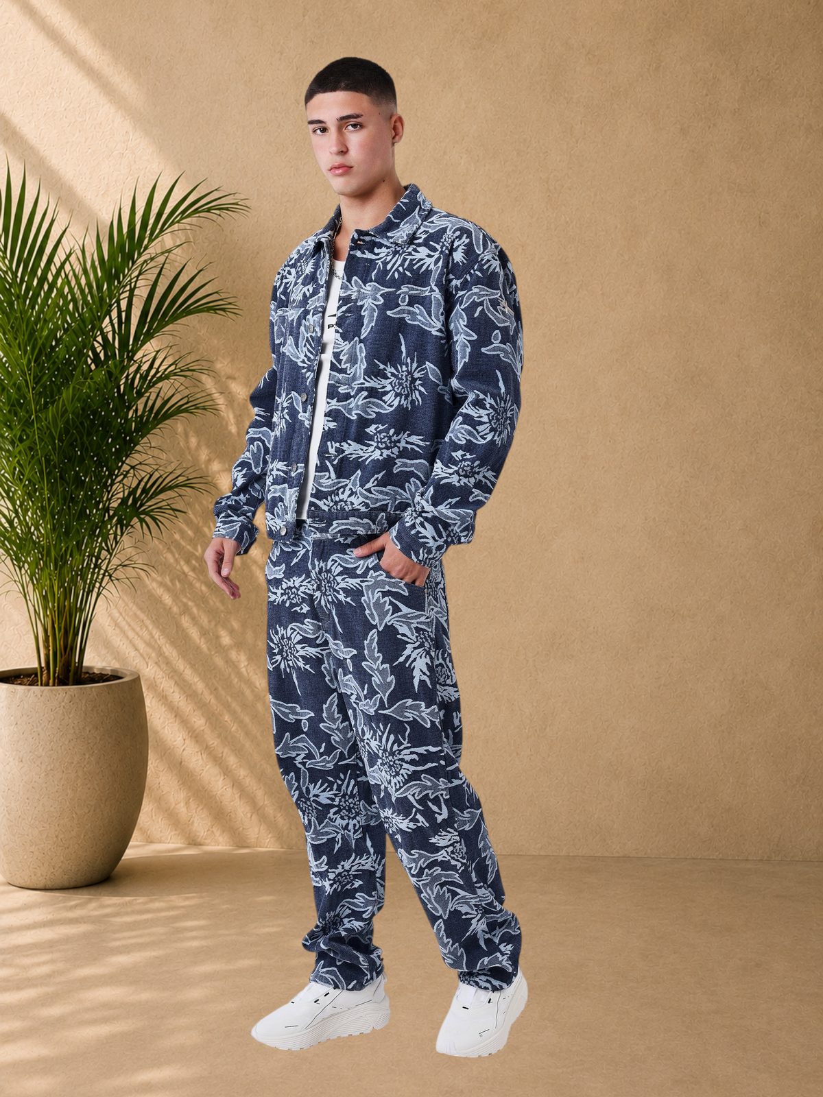 Stayin PXP boxy floral denim jacket and matching trousers worn by a male model on a white background