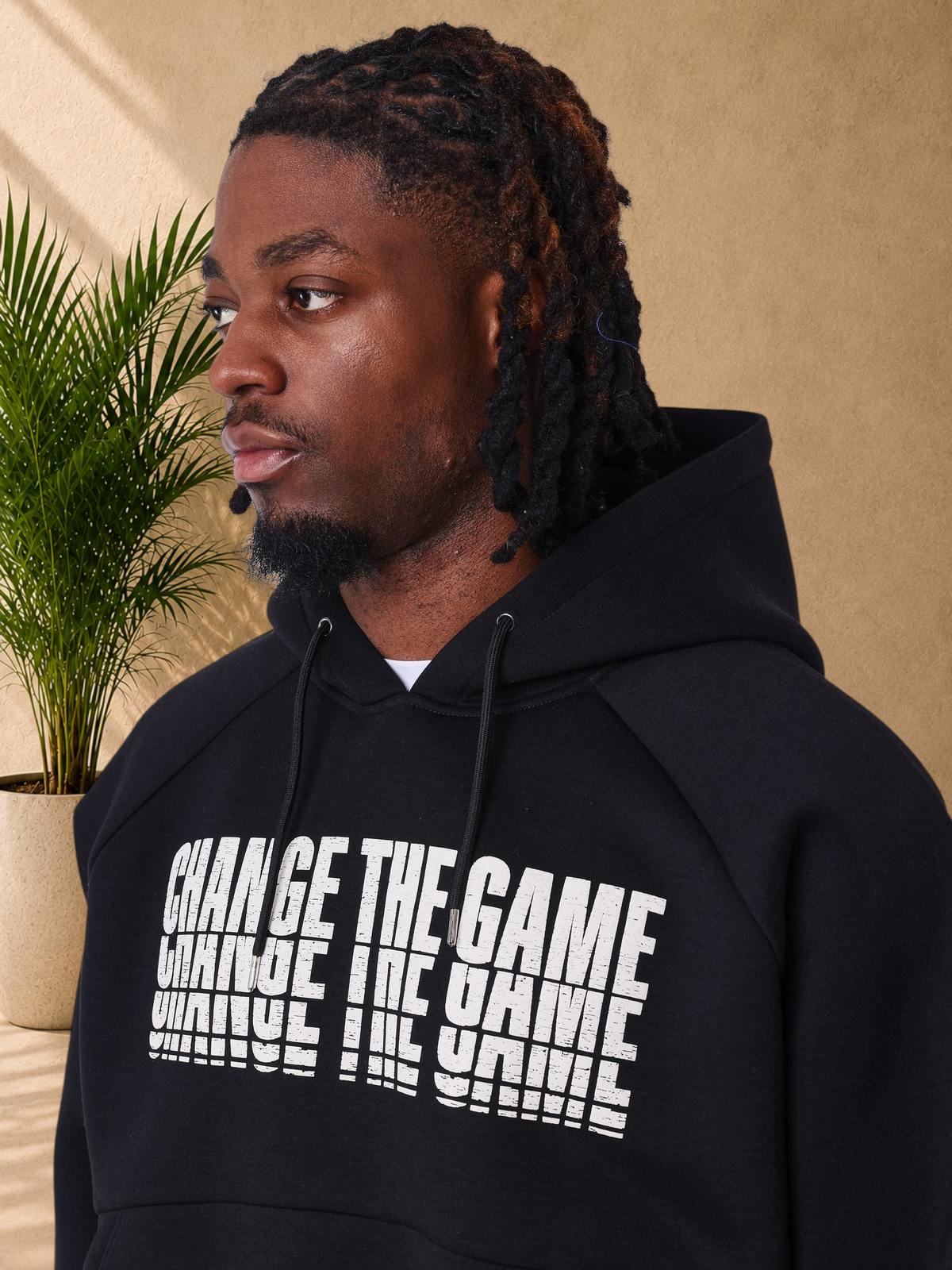 Stayin black regular fit hoodie with white distorted Change The Game text print on chest and drawstring hood