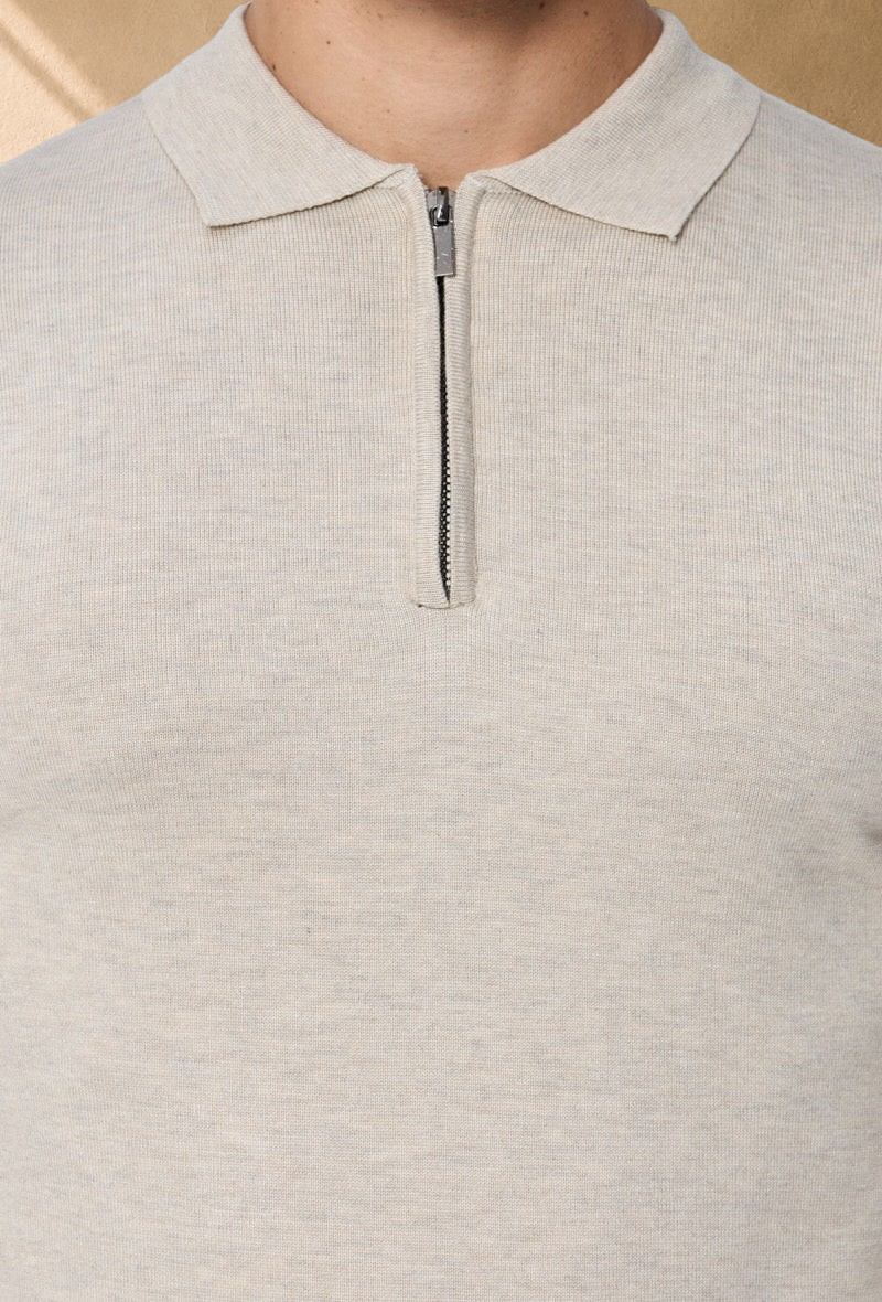 Stayin beige long sleeve polo sweater with a quarter zip collar in fine knit fabric worn by a male model