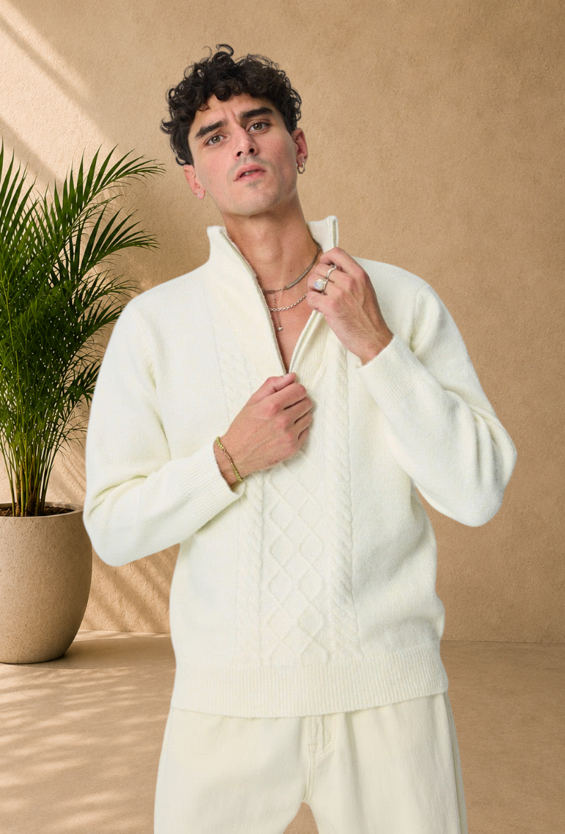 Stayin white cable knit sweater with a zip-up mock neck worn by a male model against a plain background