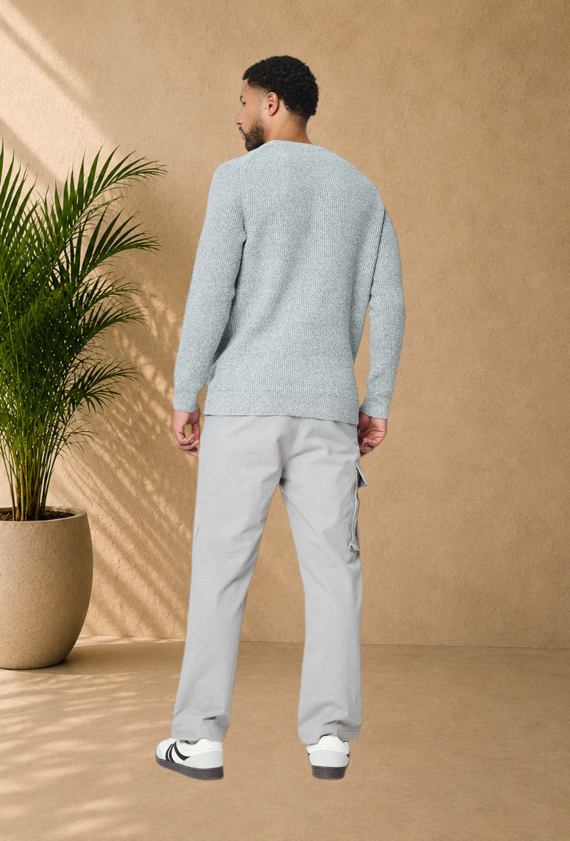 Stayin grey ribbed knit sweater worn by a man with light grey cargo pants, back view