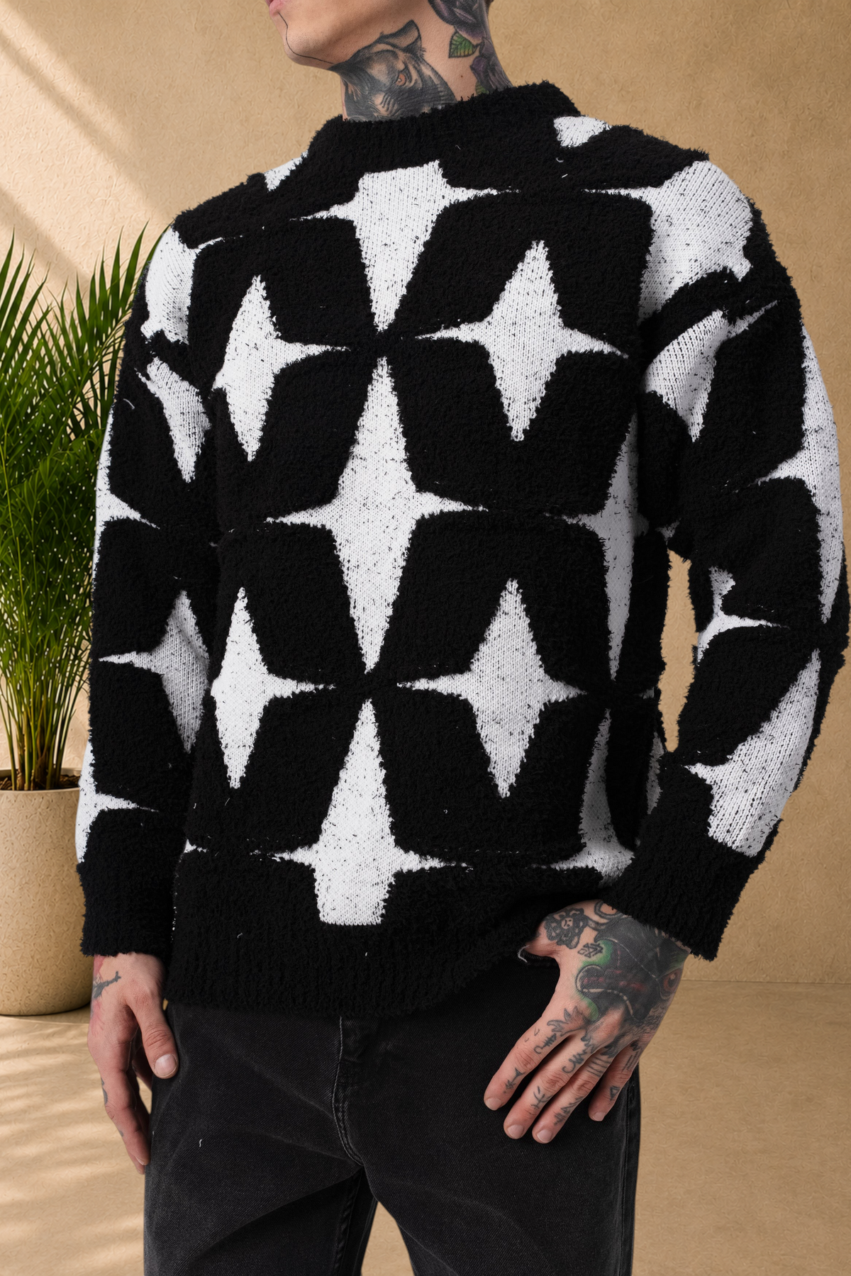 Stayin fluffy crew neck sweater with black and white star pattern worn by a model