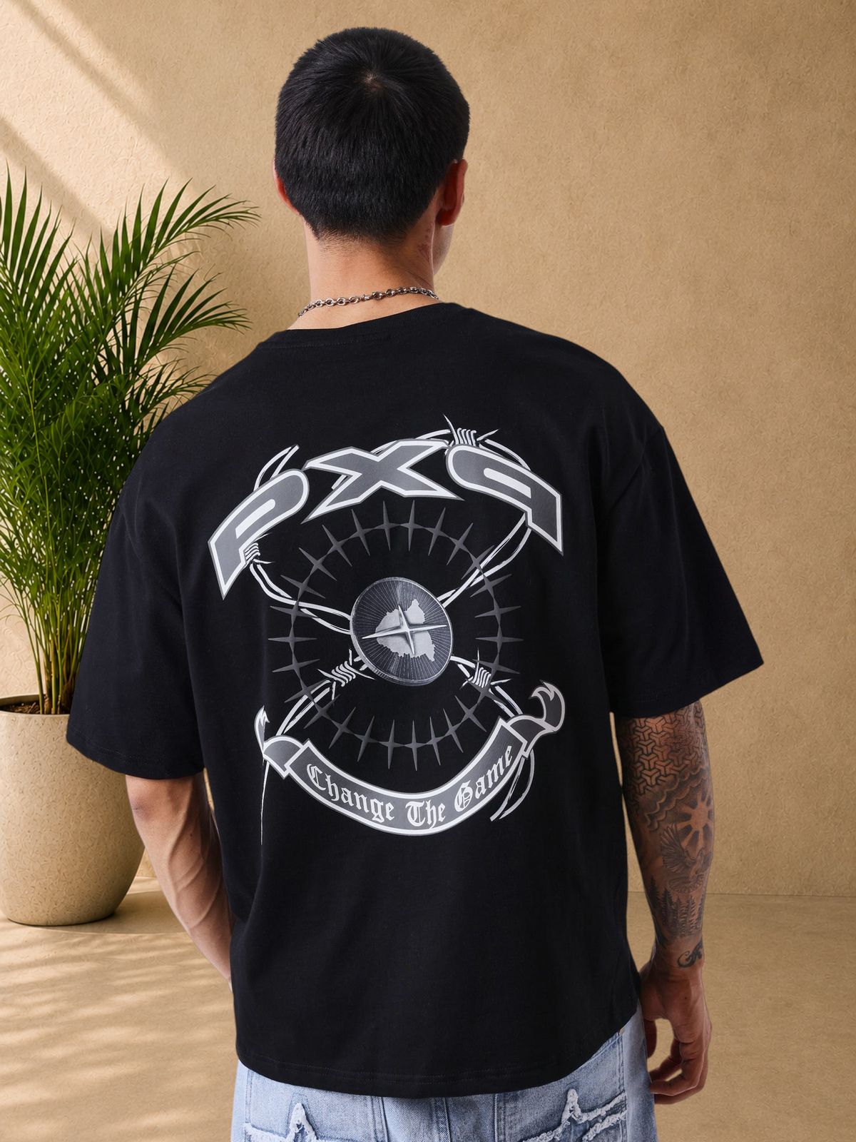 Stayin PXP black oversized cotton t-shirt with large grey graphic print on the back, featuring a round ribbed neck.