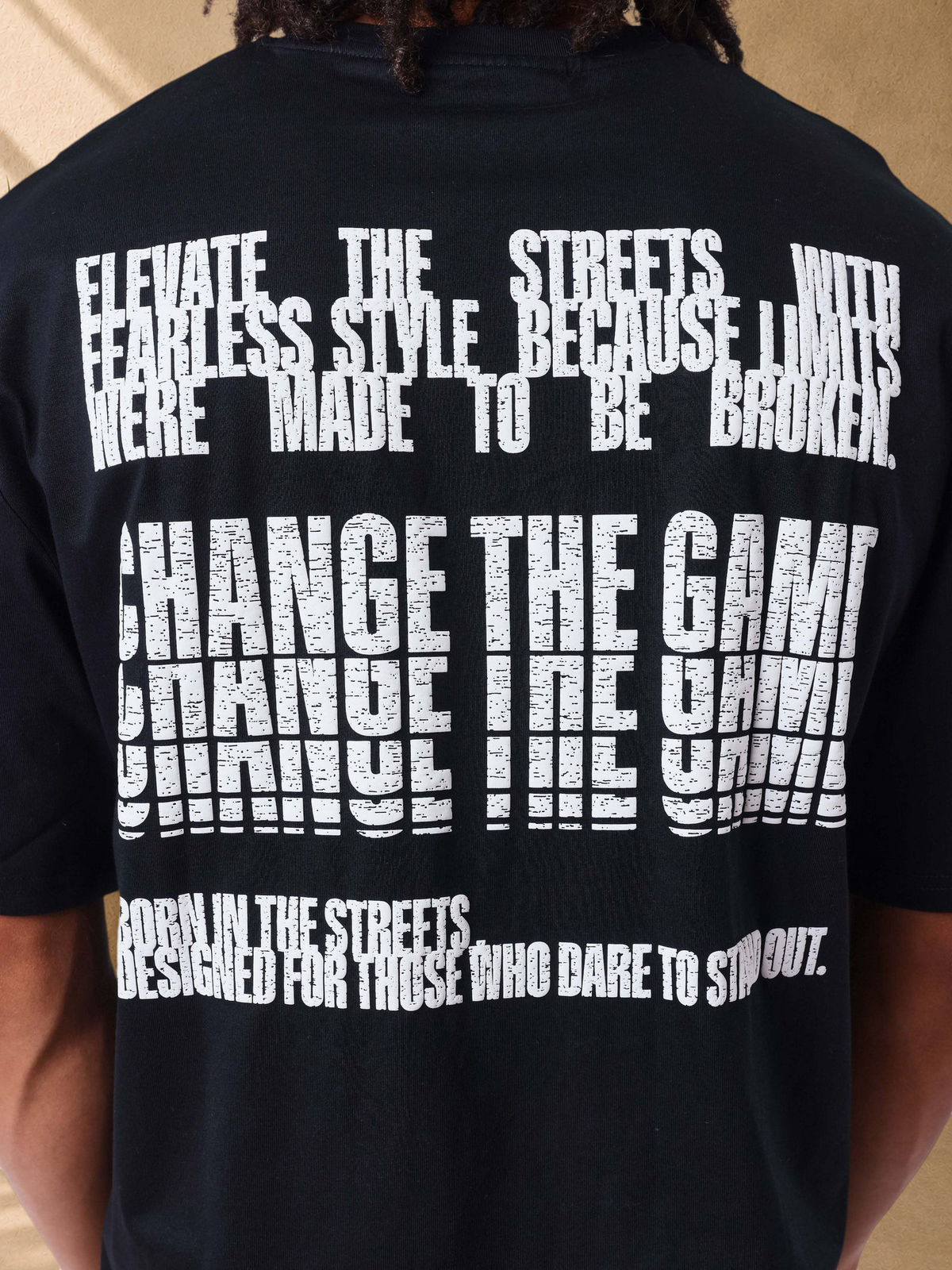 Stayin black cotton t-shirt with distressed white typographic print on the back featuring inspirational text