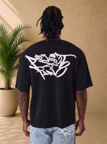 Stayin oversized black cotton t-shirt with large white graffiti graphic print on the back