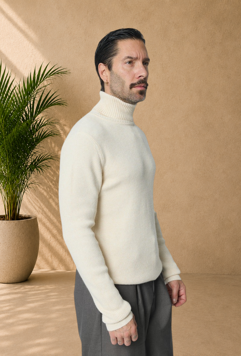 Stayin ivory ribbed knit turtleneck sweater worn by a man in a side profile view against a plain background