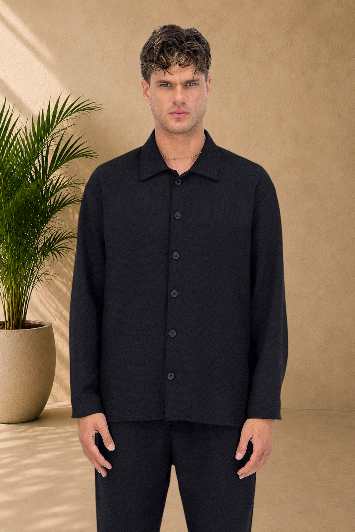Stayin black button-down overshirt with a textured finish worn by a male model against a white background