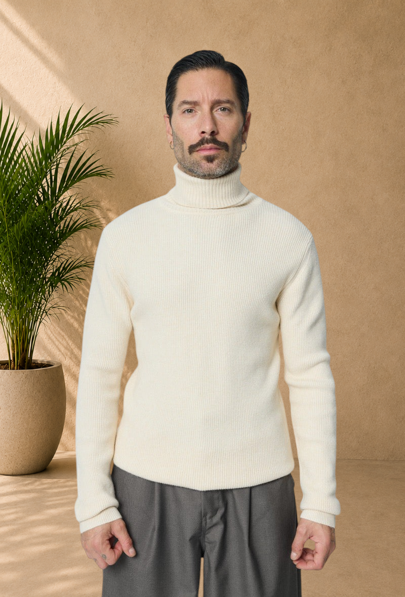 Stayin ivory ribbed knit turtleneck sweater worn by a man with a mustache against a plain background