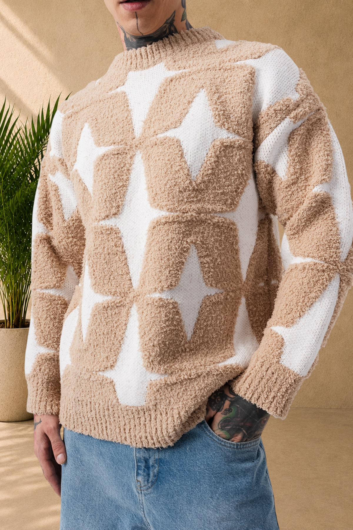 Stayin fluffy beige and white star pattern sweater with a crew neck worn by a model with blue jeans