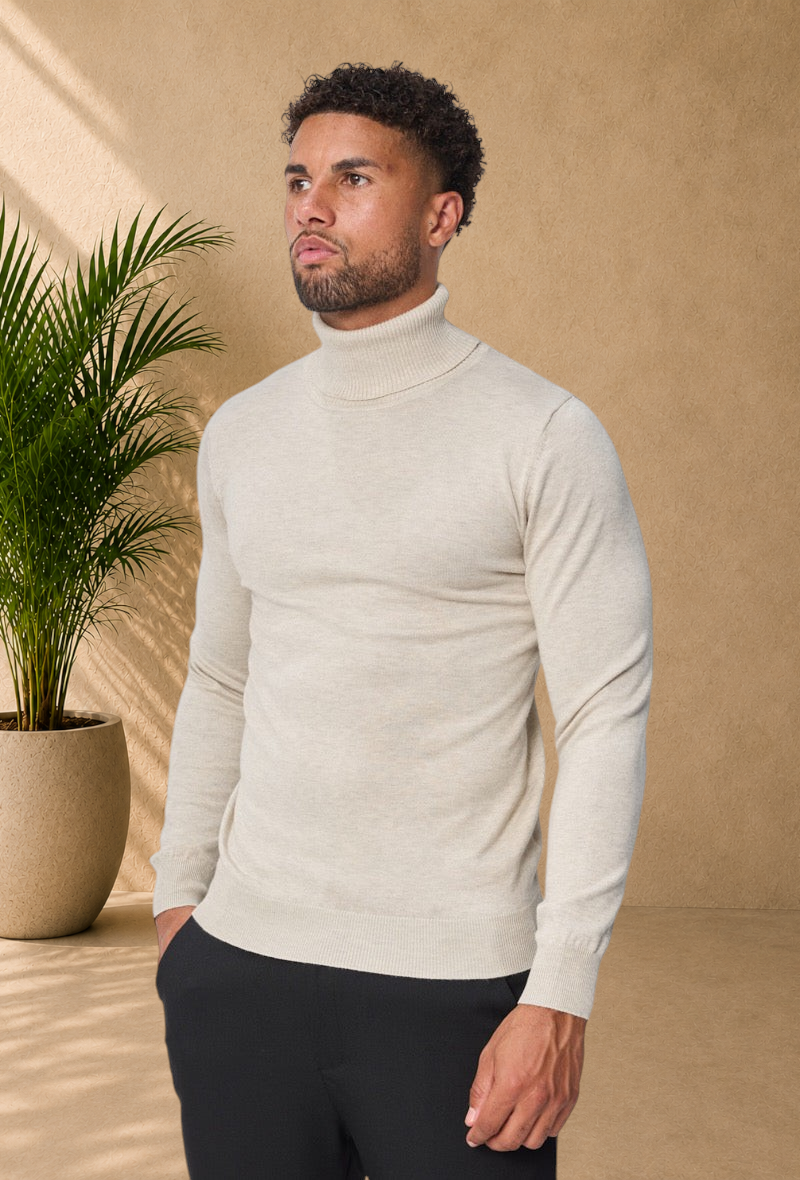 Stayin beige slim-fit turtleneck sweater worn by a male model on a white background