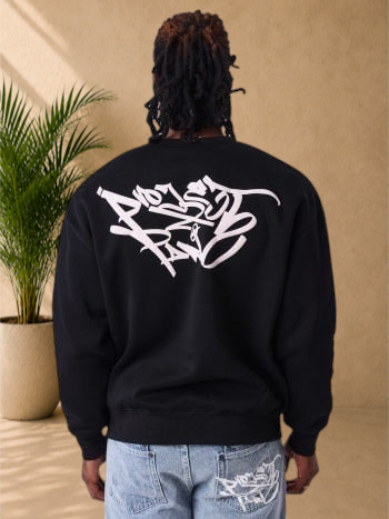 Stayin black regular fit sweatshirt with white graffiti-style back print worn by a man