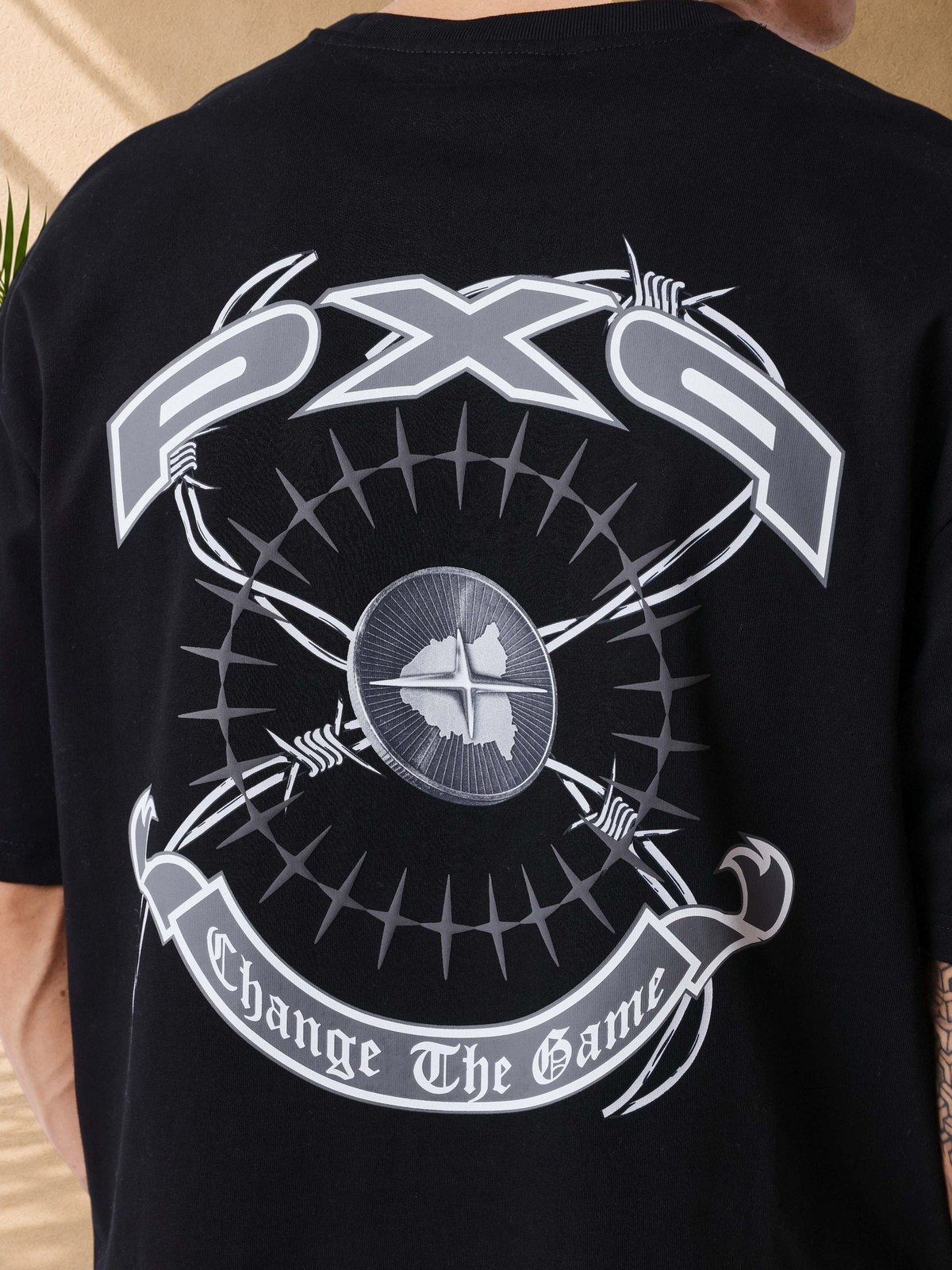 Stayin PXP black oversized cotton t-shirt featuring a large grey graphic print with barbed wire on the back