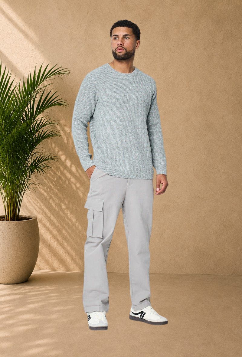 Stayin grey ribbed knit sweater with crew neck worn by a male model with light grey cargo pants