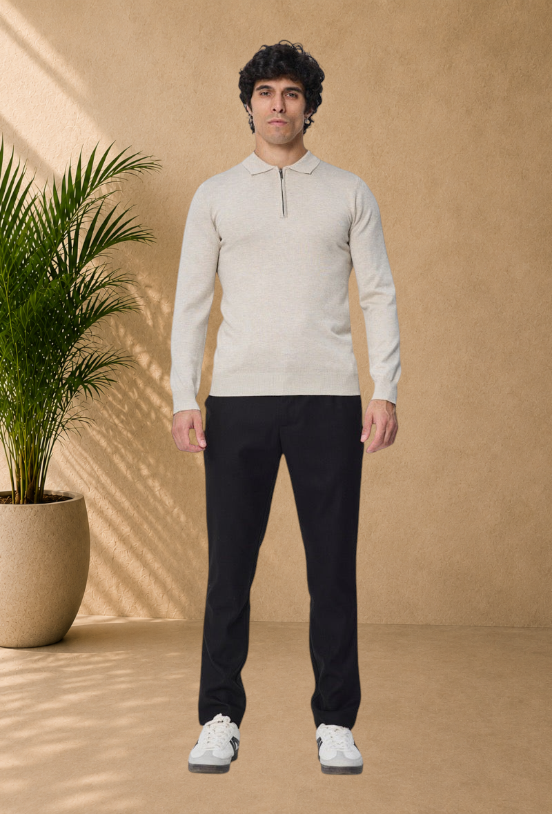 Stayin beige long-sleeve polo sweater with a quarter-zip collar worn by a male model with black trousers