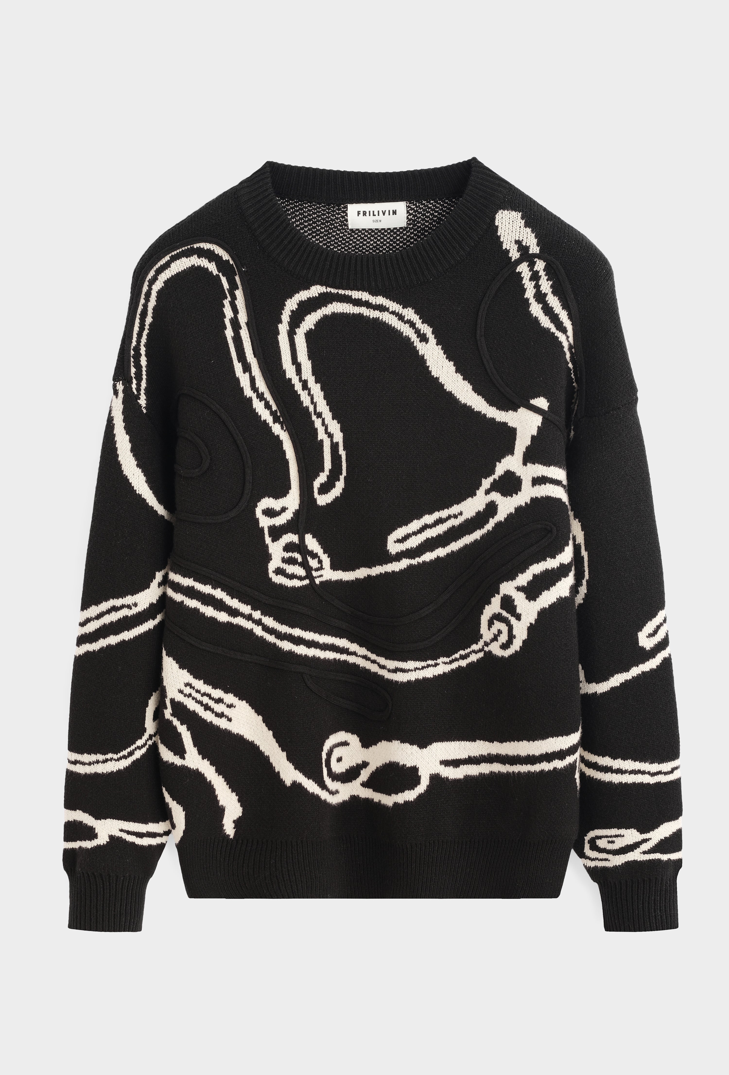 Pull noir motif beige