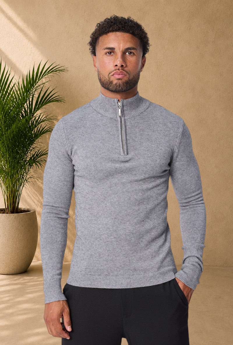 Stayin grey knit sweater with a quarter-zip mock neck worn by a model against a plain background
