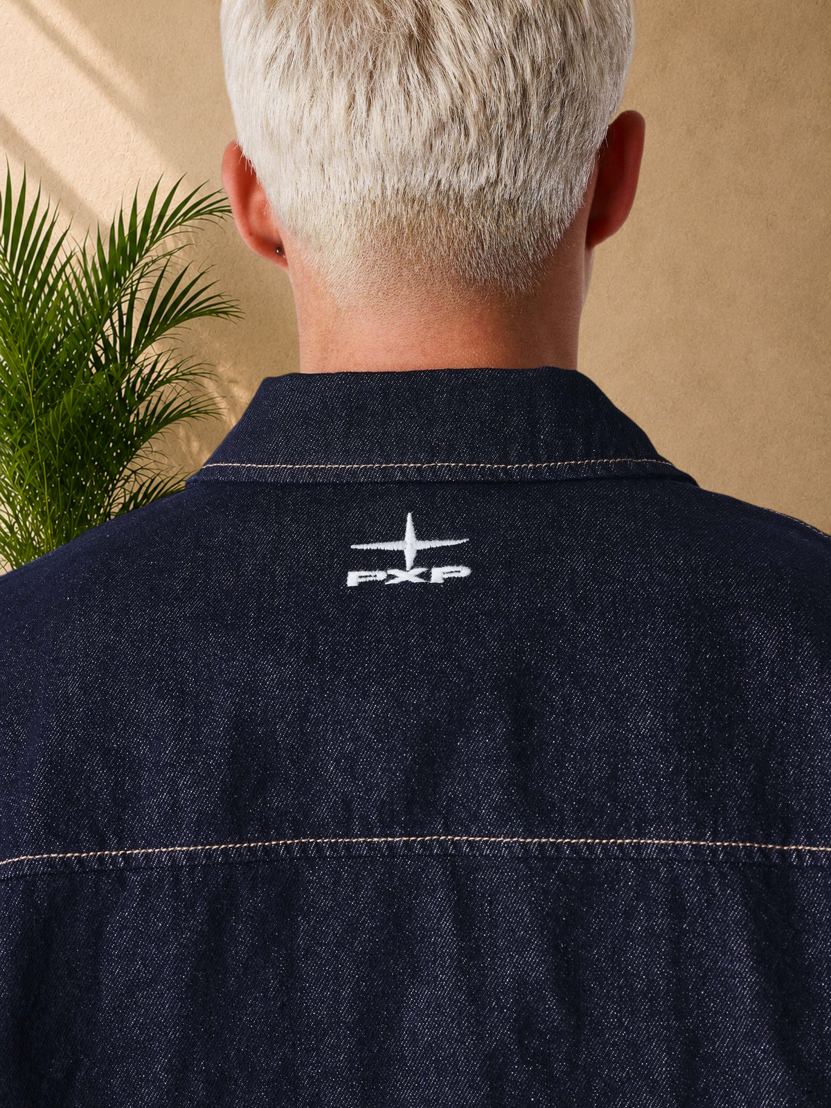 Stayin PXP dark blue denim short sleeve shirt with white embroidered logo on the back collar