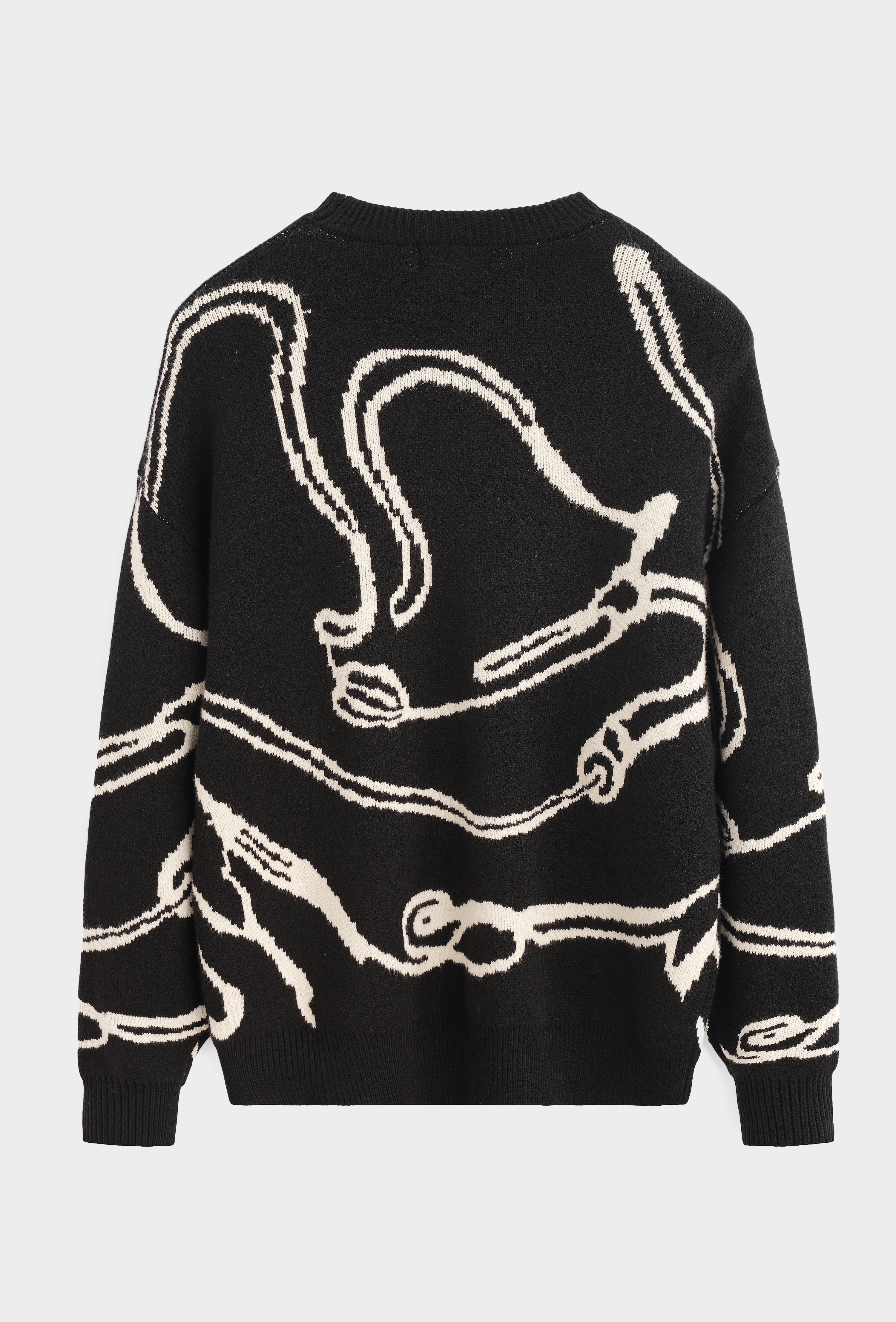 Pull noir motif beige