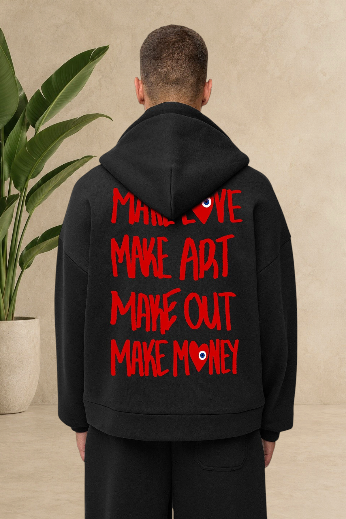 Vue arrière du sweat zippé à capuche noir Stayin avec grand imprimé graphique rouge Make Love au dos
