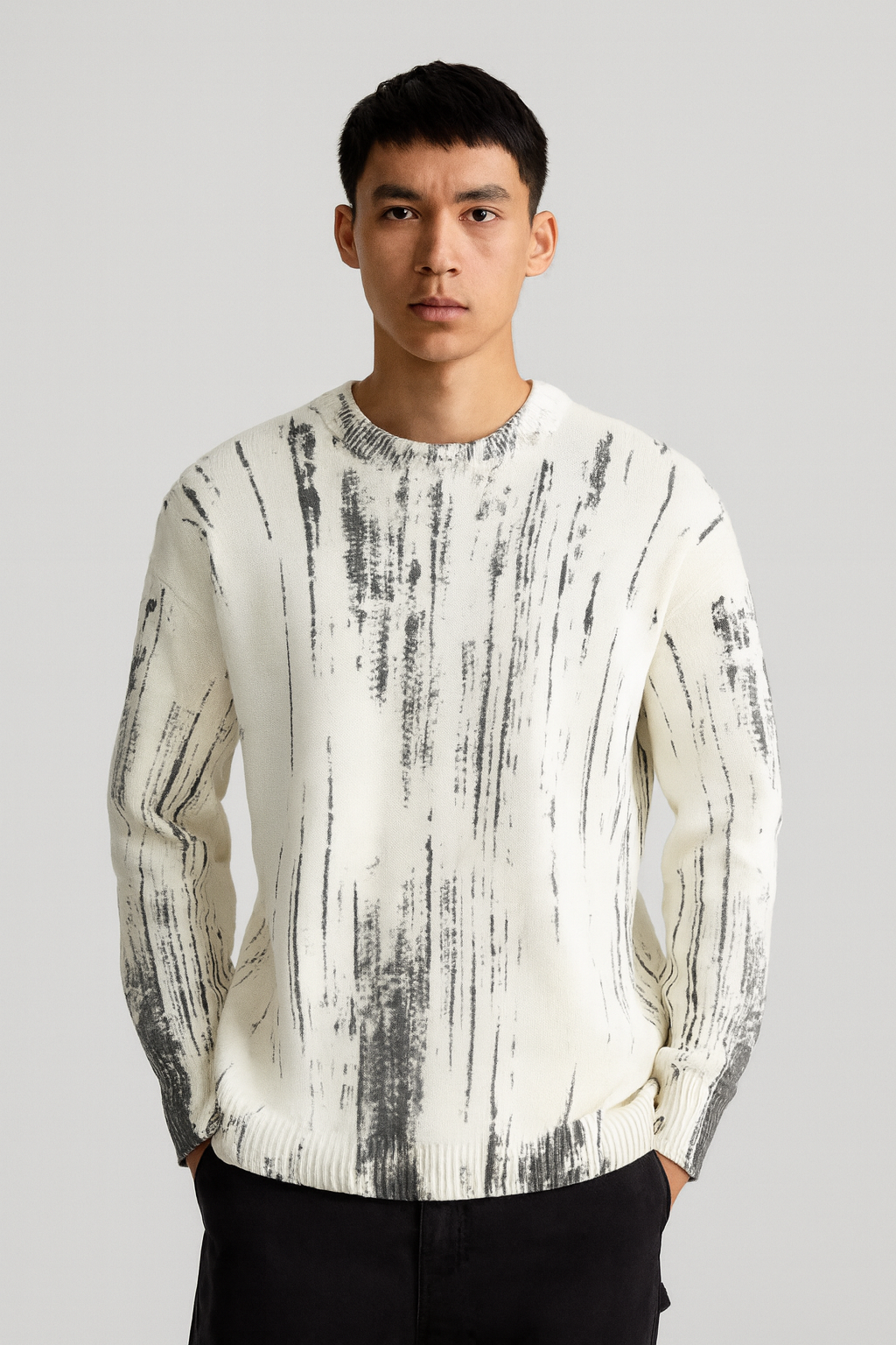 Pull beige motif gris