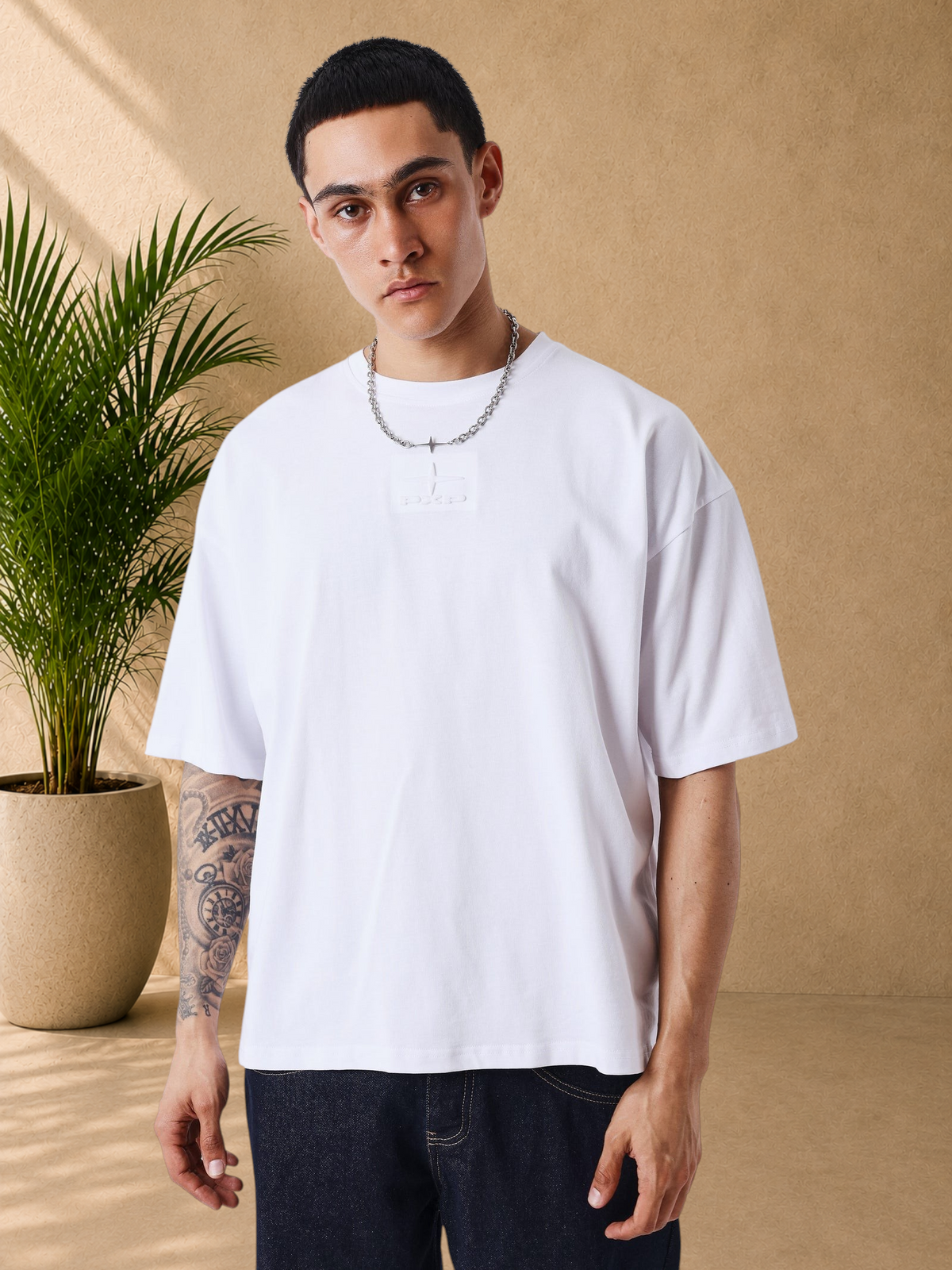 Stayin white boxy fit cotton t-shirt with tonal embossed chest logo worn by a model