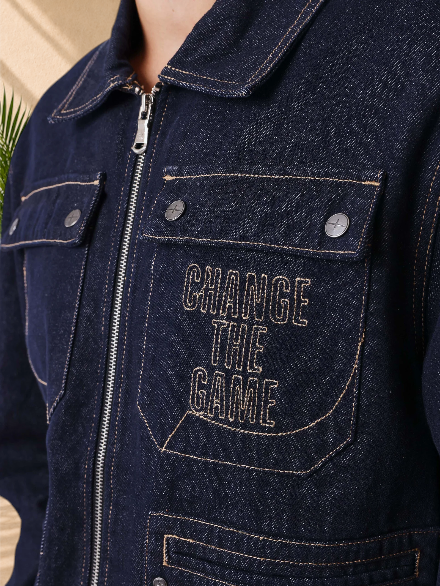 Stayin dark blue denim jacket with Change The Game embroidery, chest pocket, and metal zipper closure.