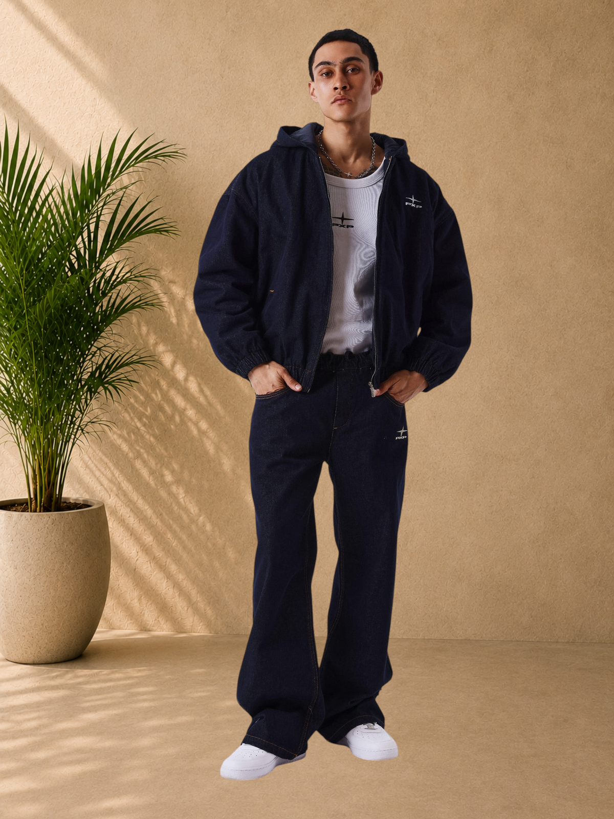 Stayin PXP boxy fit dark denim hooded zip-up jacket with logo embroidery worn by a male model