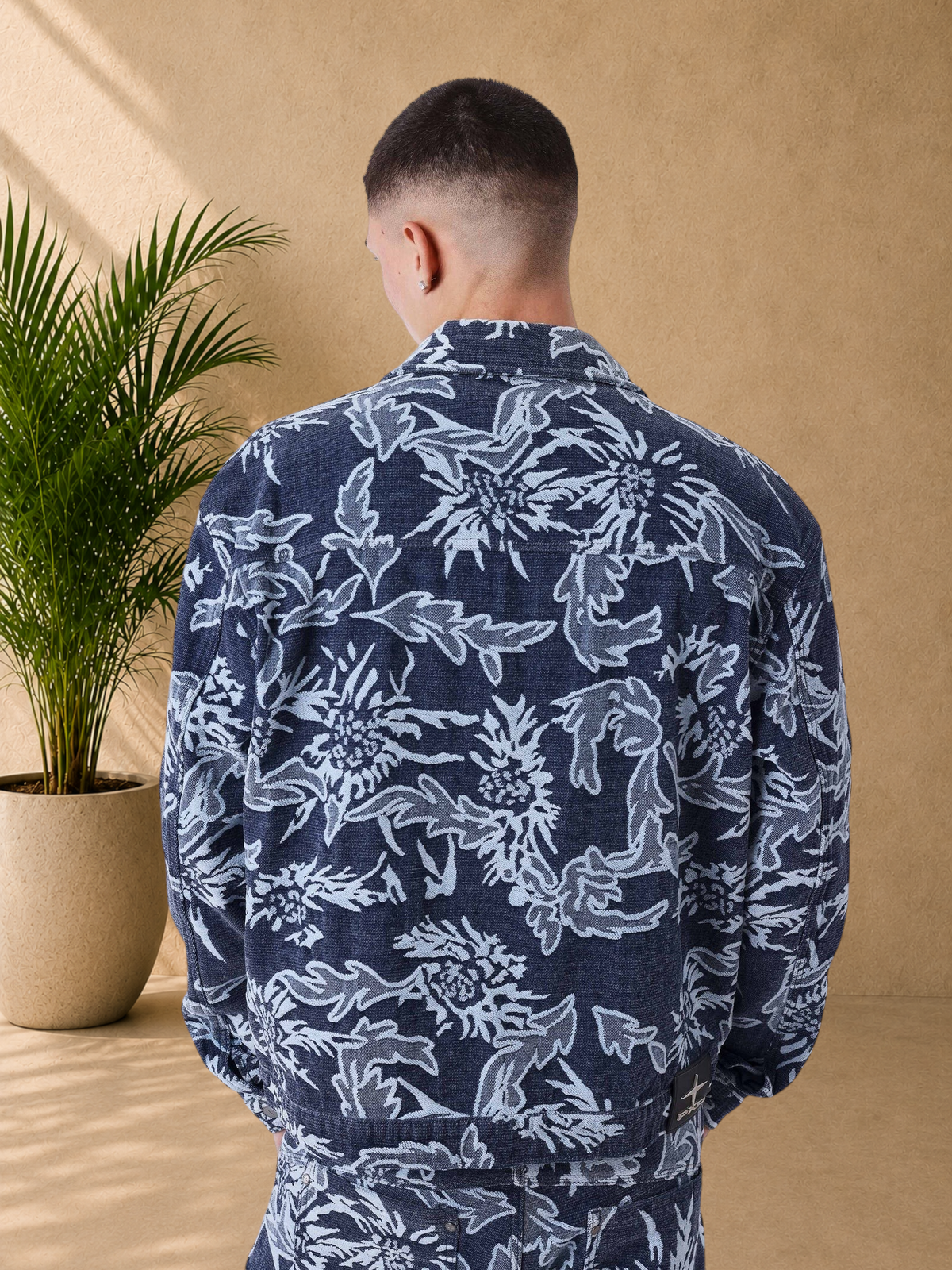 Stayin boxy fit denim jacket with a blue and white floral pattern, featuring a classic collar and buttoned cuffs.