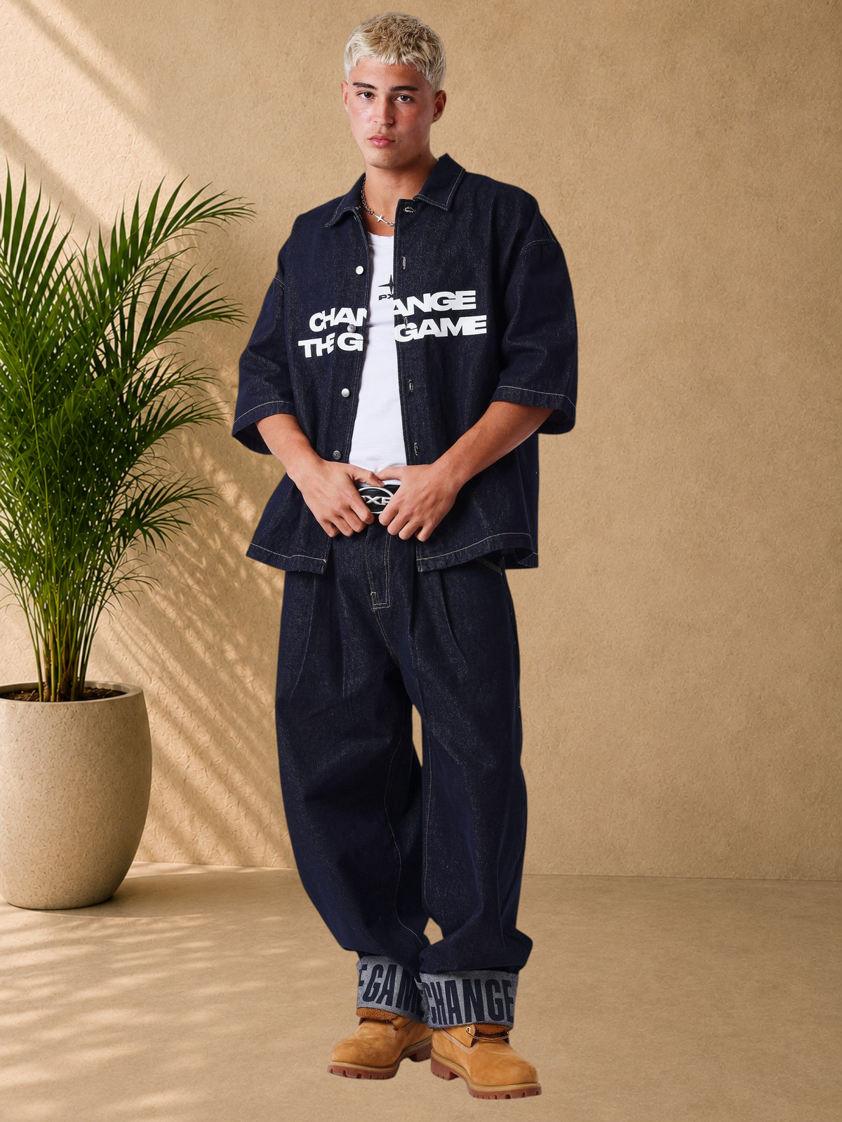 Stayin PXP oversized dark denim short-sleeve shirt with graphic print worn by a model in a studio setting.