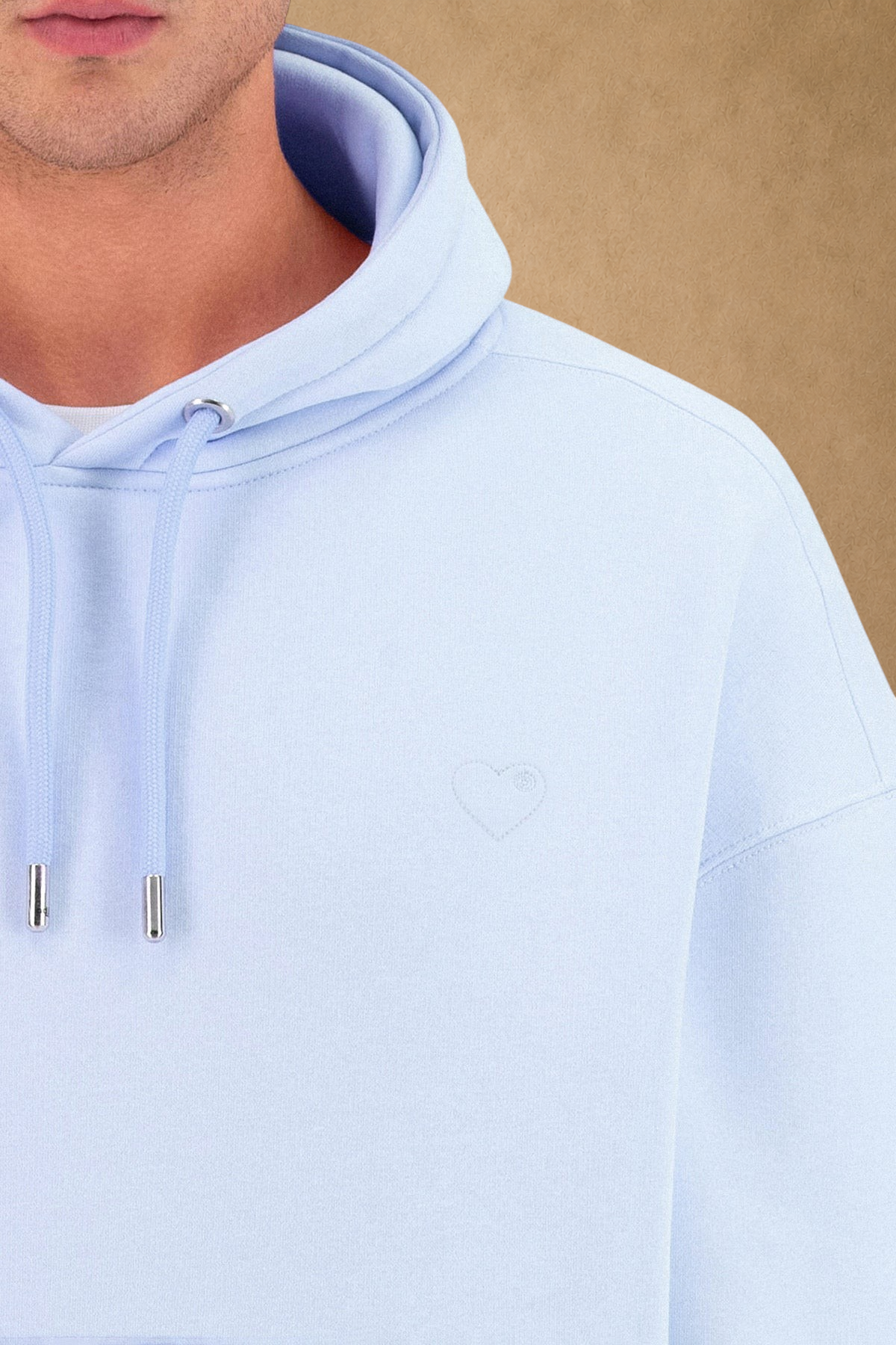 Stayin light blue quilted hoodie for men with a small embroidered heart detail and matching drawstring hood