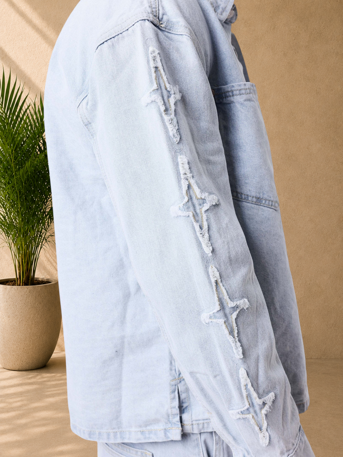 Stayin light blue denim jacket with Polaris star-shaped distressed patches on the sleeves and chest logo
