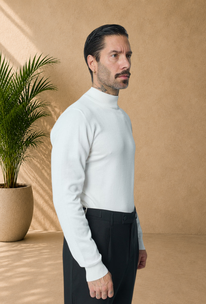 Stayin white slim-fit mock neck sweater worn by a male model in a studio setting