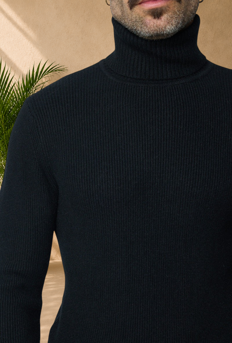 Stayin black ribbed knit turtleneck sweater worn by a man, featuring a modern textured design for a versatile look.