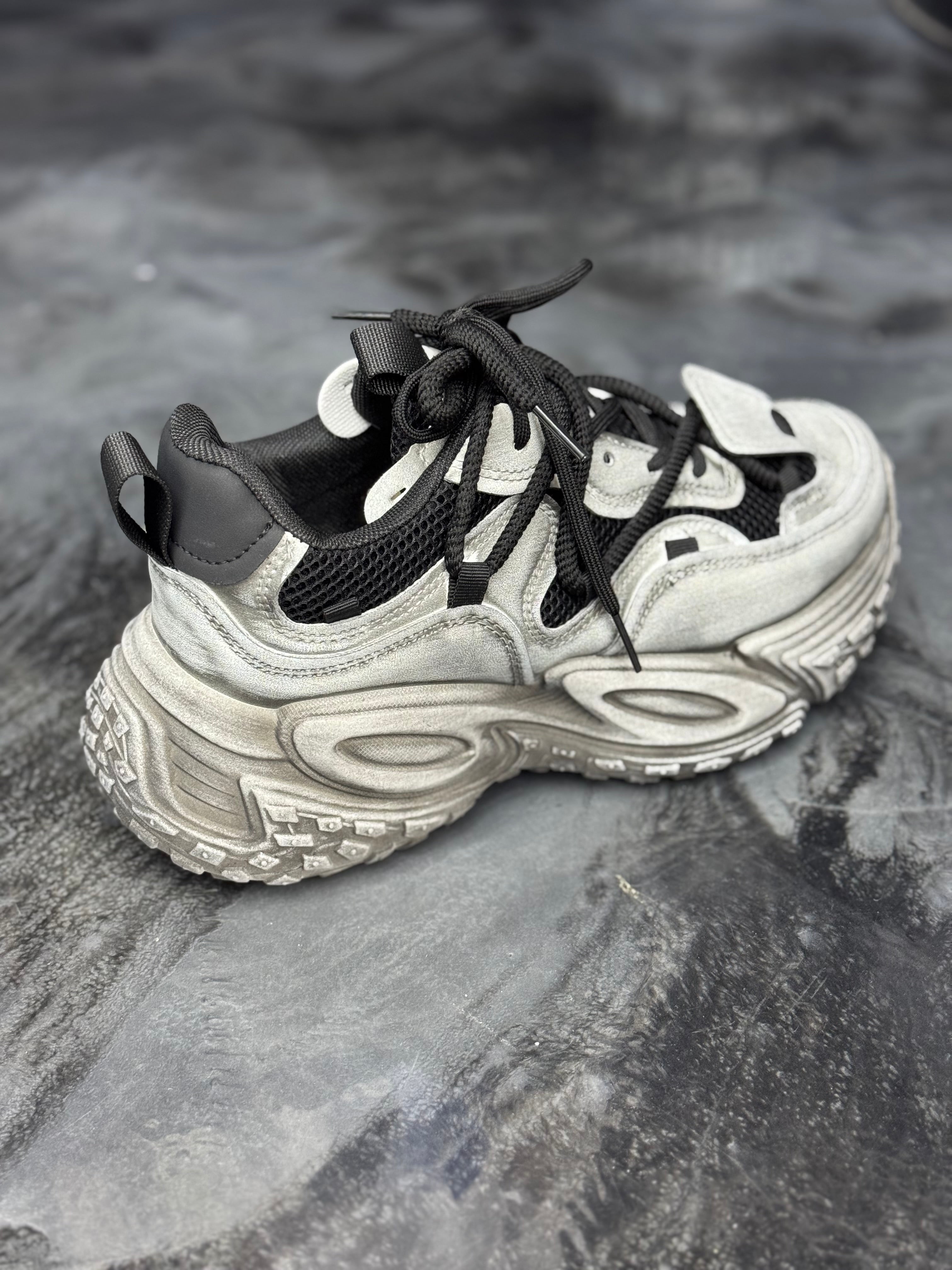 Basket Nomad grise / noir