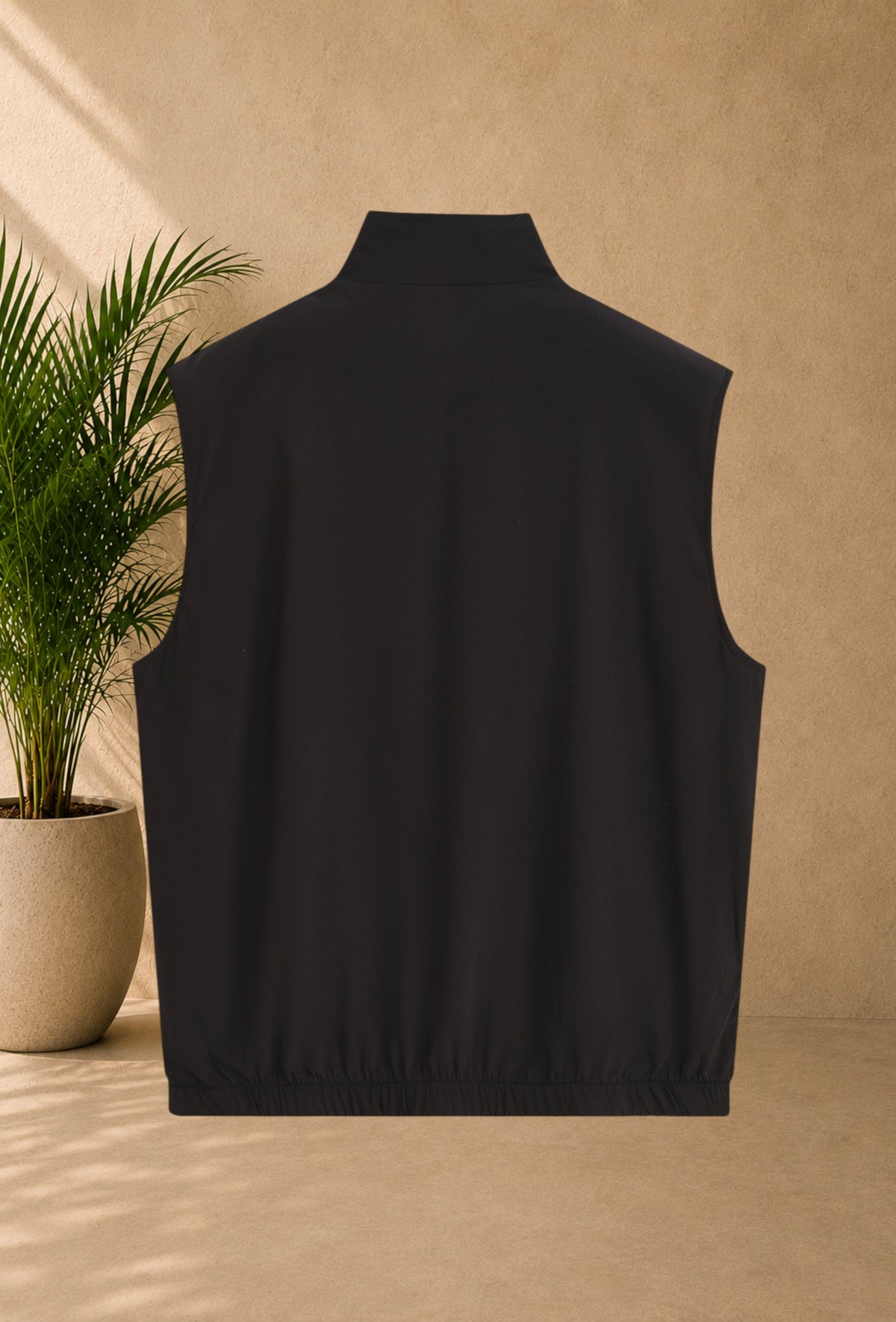 Stayin reversible sleeveless vest in black, featuring a zip closure and thick soft lining for winter comfort.