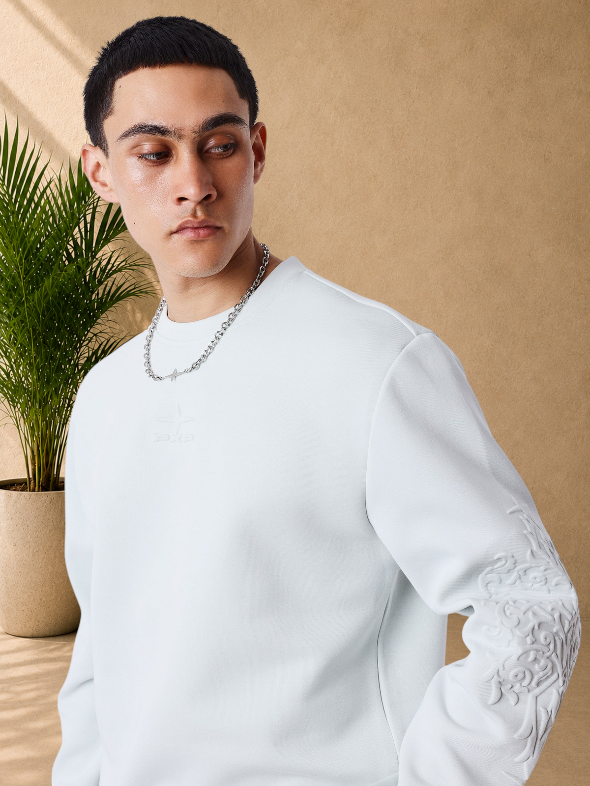 Stayin light grey regular fit sweatshirt with tonal logo and embossed sleeve detail worn by a male model