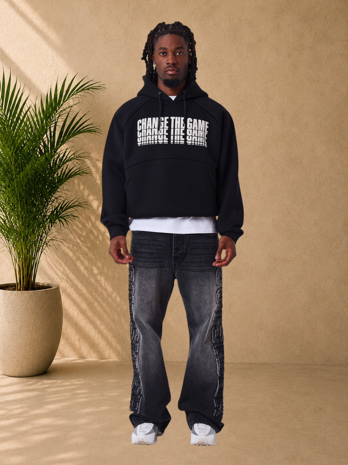 Stayin black regular fit hoodie with Change The Game white graphic print, kangaroo pocket, and raglan sleeves