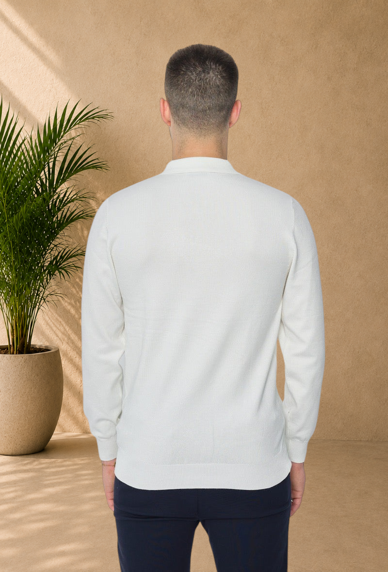Back view of a man wearing a Stayin white long-sleeve polo sweater with a zip collar in fine knit fabric