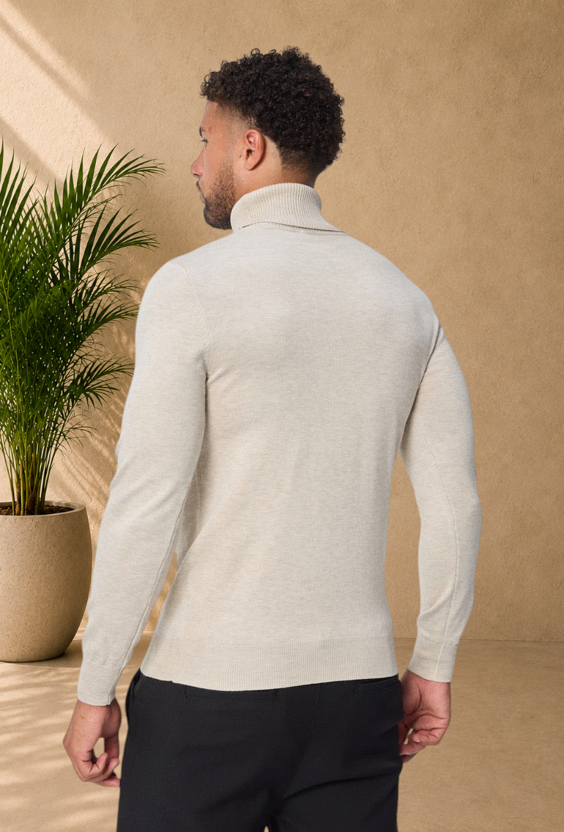 Stayin beige slim-fit turtleneck sweater worn by a male model, back view, isolated on white background.