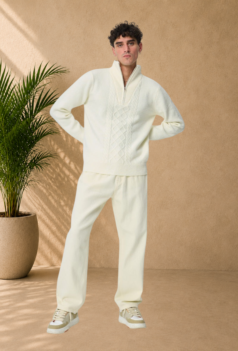Stayin white cable knit sweater with a zip-up mock neck worn by a male model with matching trousers