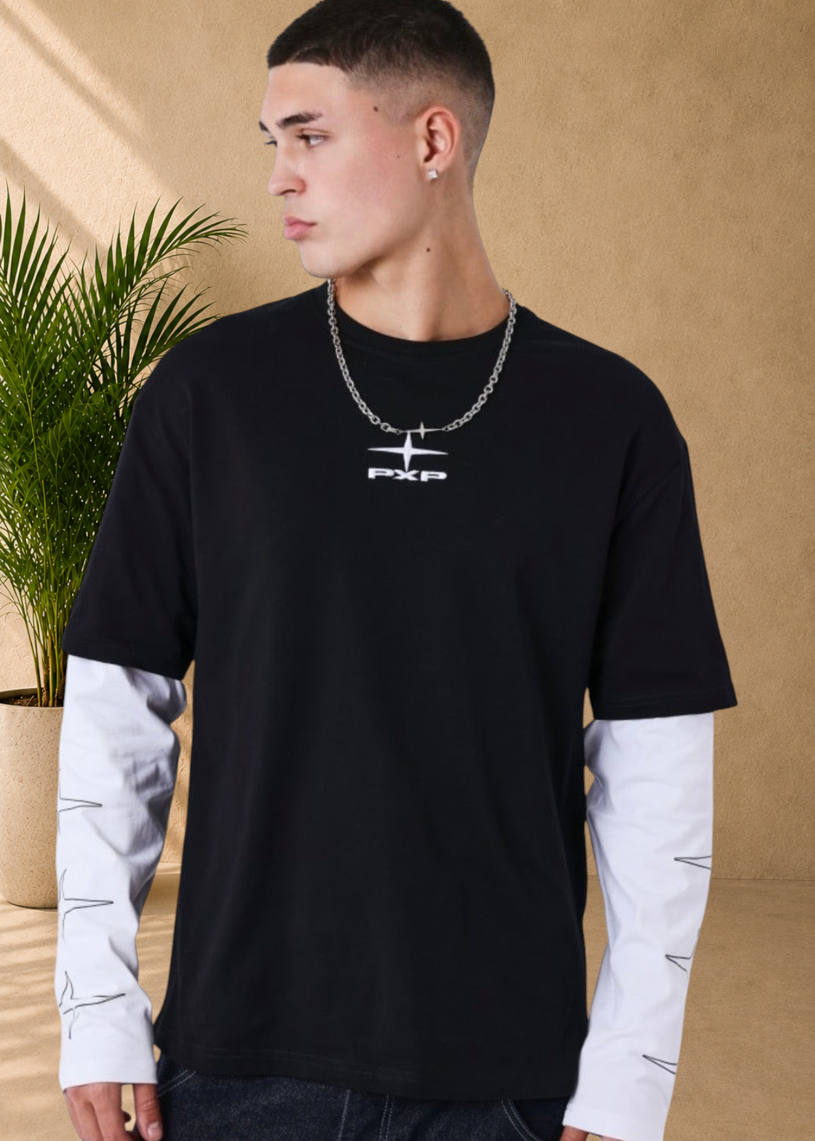 Stayin black and white boxy fit cotton t-shirt with long layered sleeves and floral chest print on a male model