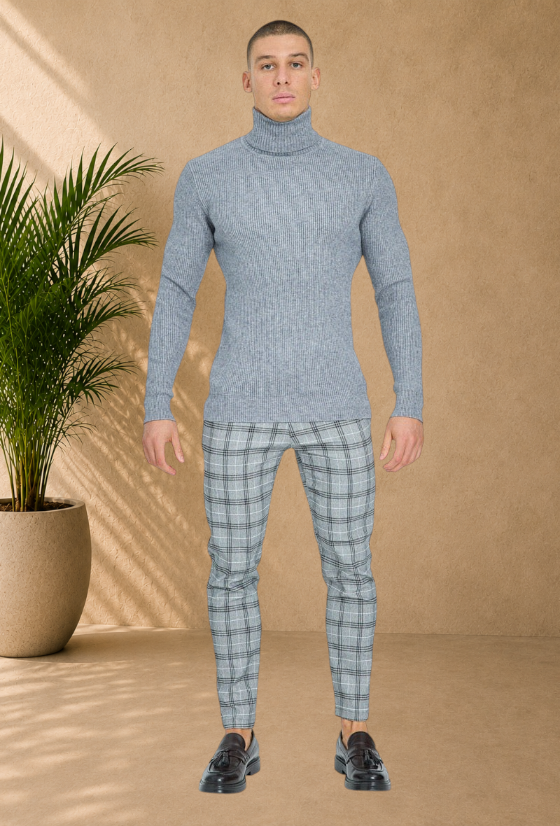 Stayin grey ribbed turtleneck sweater worn by a male model with plaid trousers and loafers