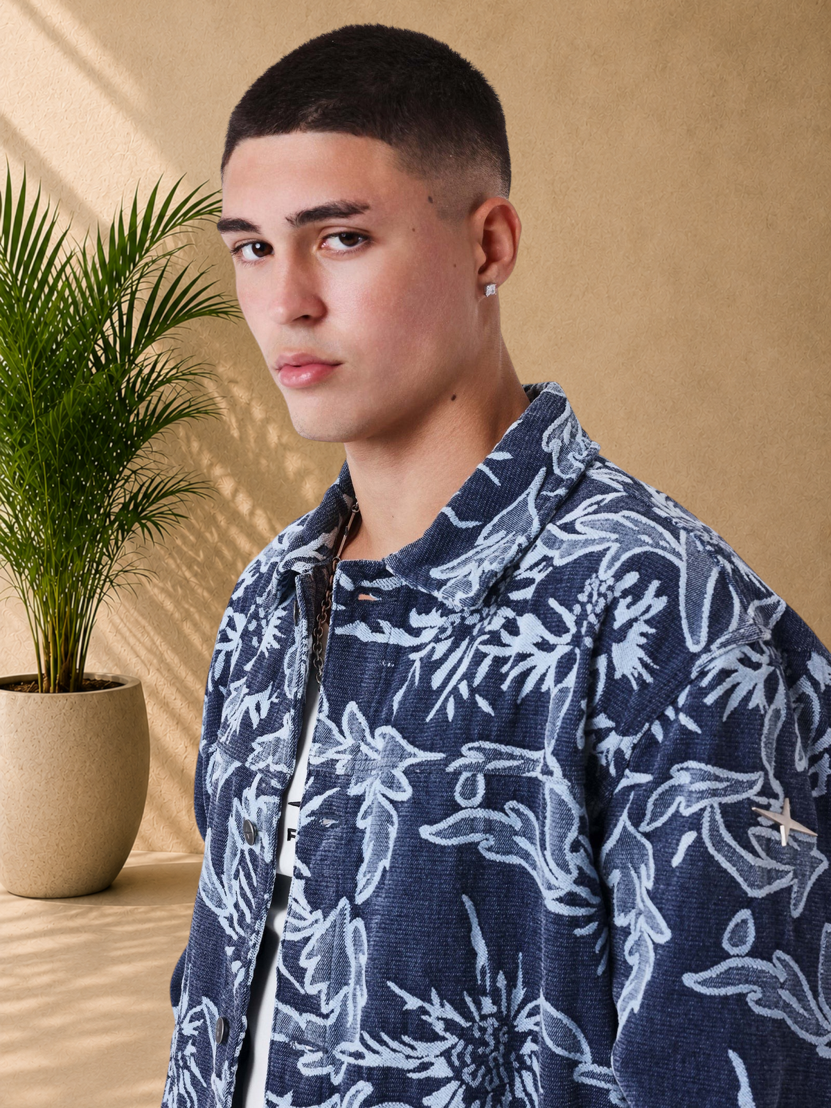 Stayin boxy fit denim jacket with a blue and white floral pattern, featuring a classic collar and button closure.