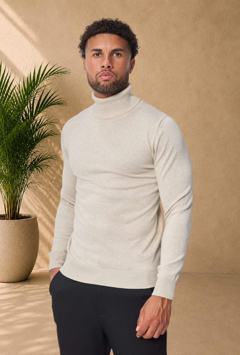Stayin beige slim-fit turtleneck sweater worn by a male model against a plain white background