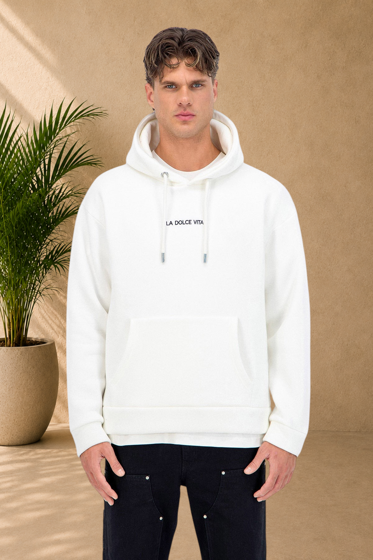 Stayin white quilted hoodie with La Dolce Vita text on chest worn by a male model