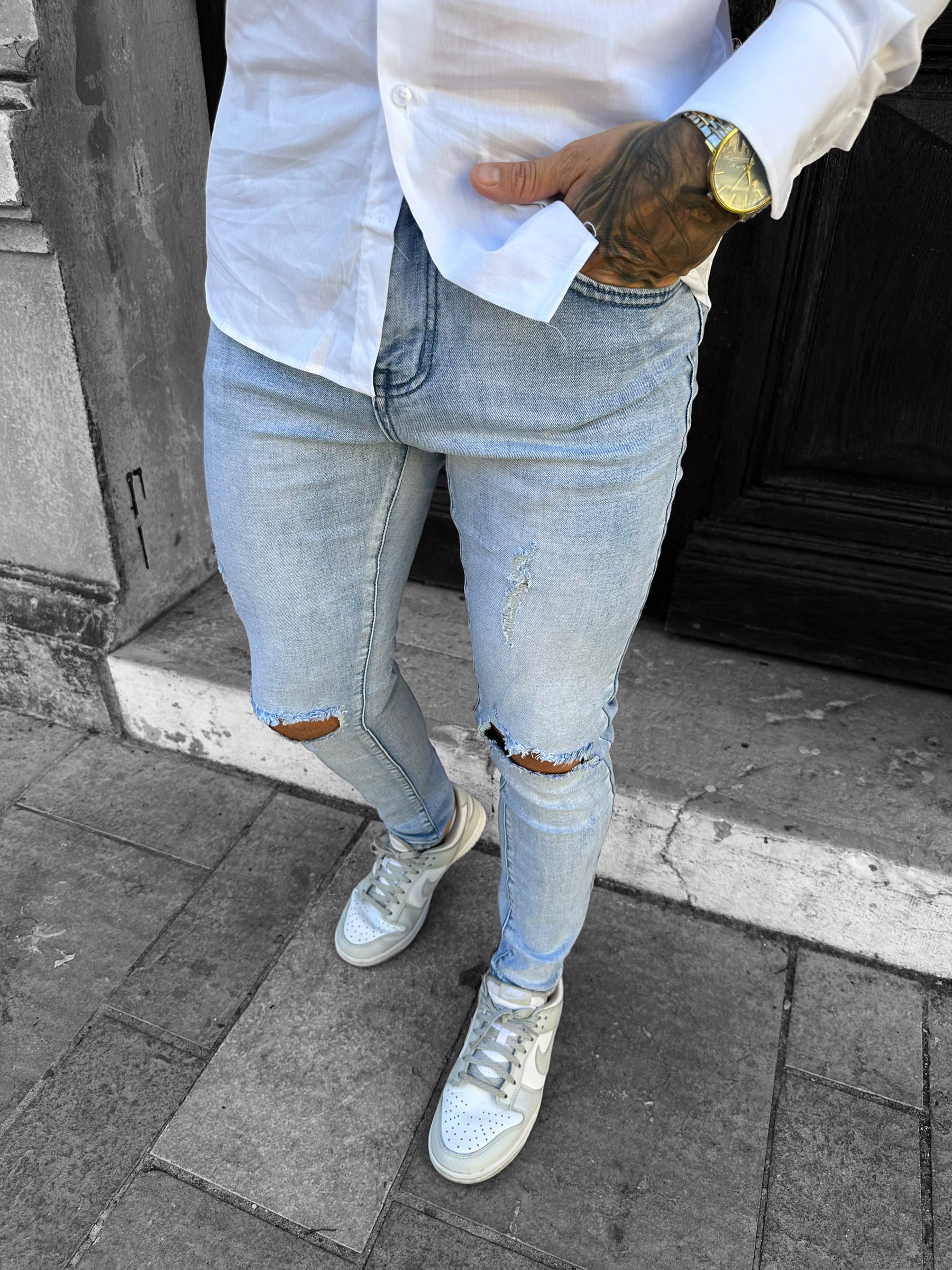 Light blue destroyed slim jeans